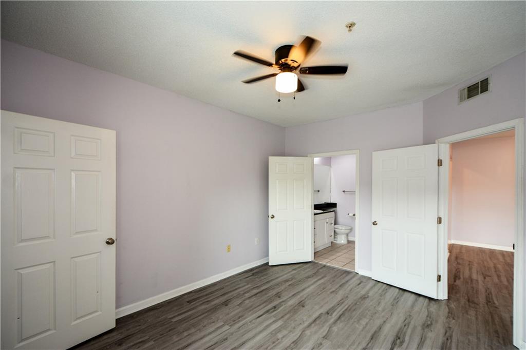 955 Juniper Street Northeast, Unit 4112 Atlanta, GA 30309 - Photo 21 of 27 a view of empty room with wooden floor