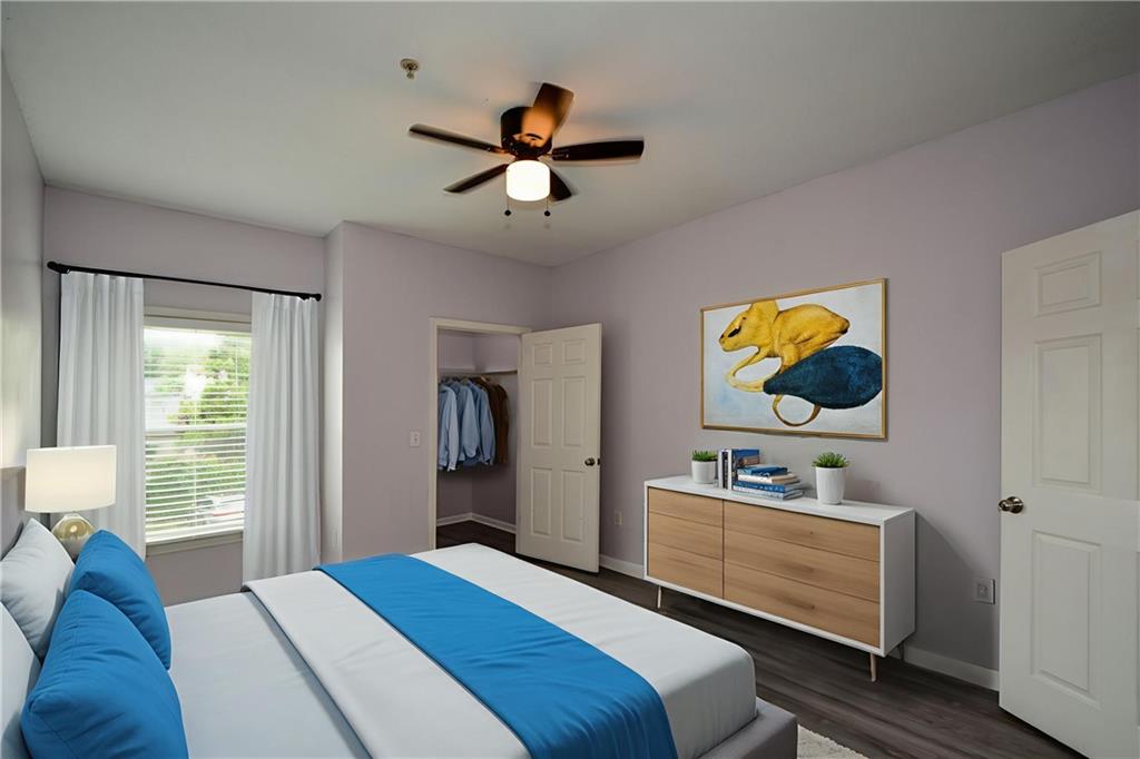 955 Juniper Street Northeast, Unit 4112 Atlanta, GA 30309 - Photo 22 of 27 a bedroom with a bed and furniture