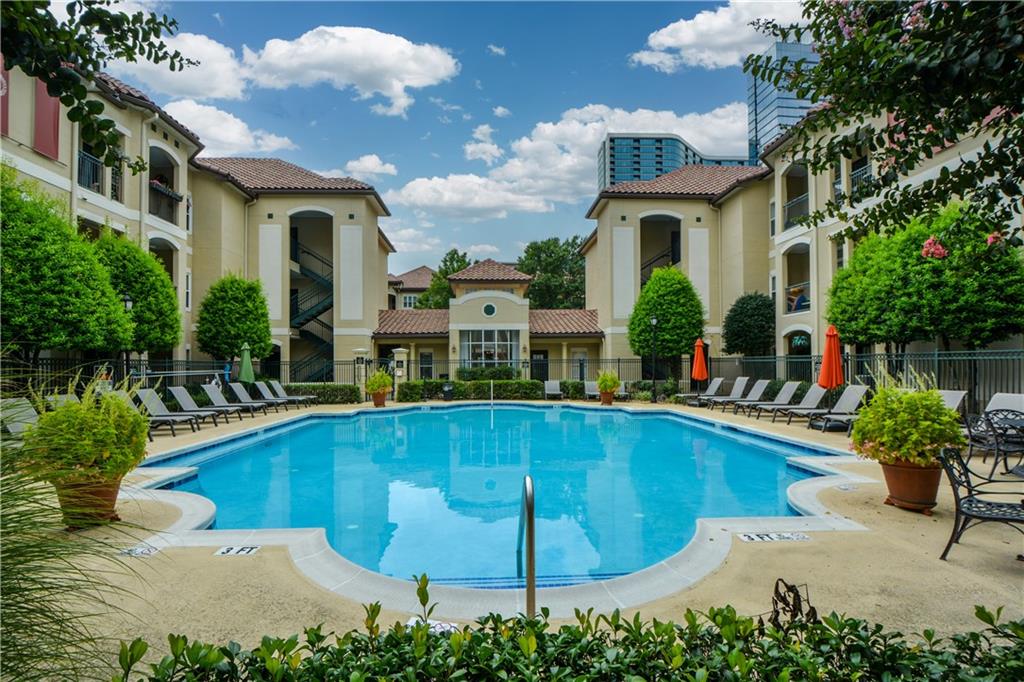 955 Juniper Street Northeast, Unit 4112 Atlanta, GA 30309 - Photo 23 of 27 a view of a house with swimming pool and sitting area