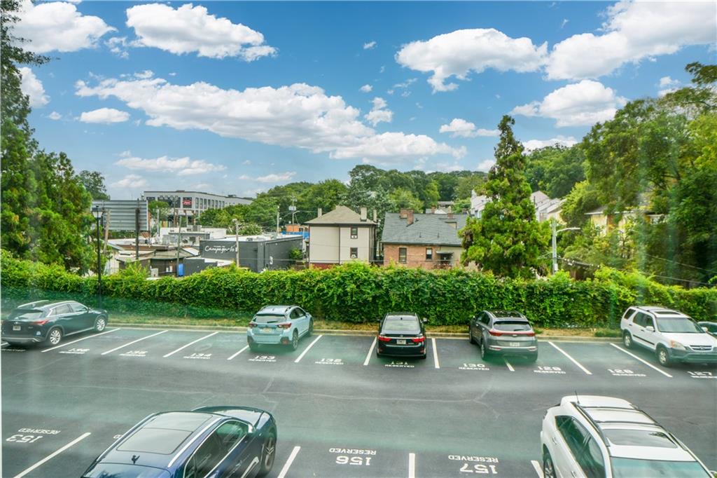 955 Juniper Street Northeast, Unit 4112 Atlanta, GA 30309 - Photo 25 of 27 a view of a patio with couches table and chairs and potted plants