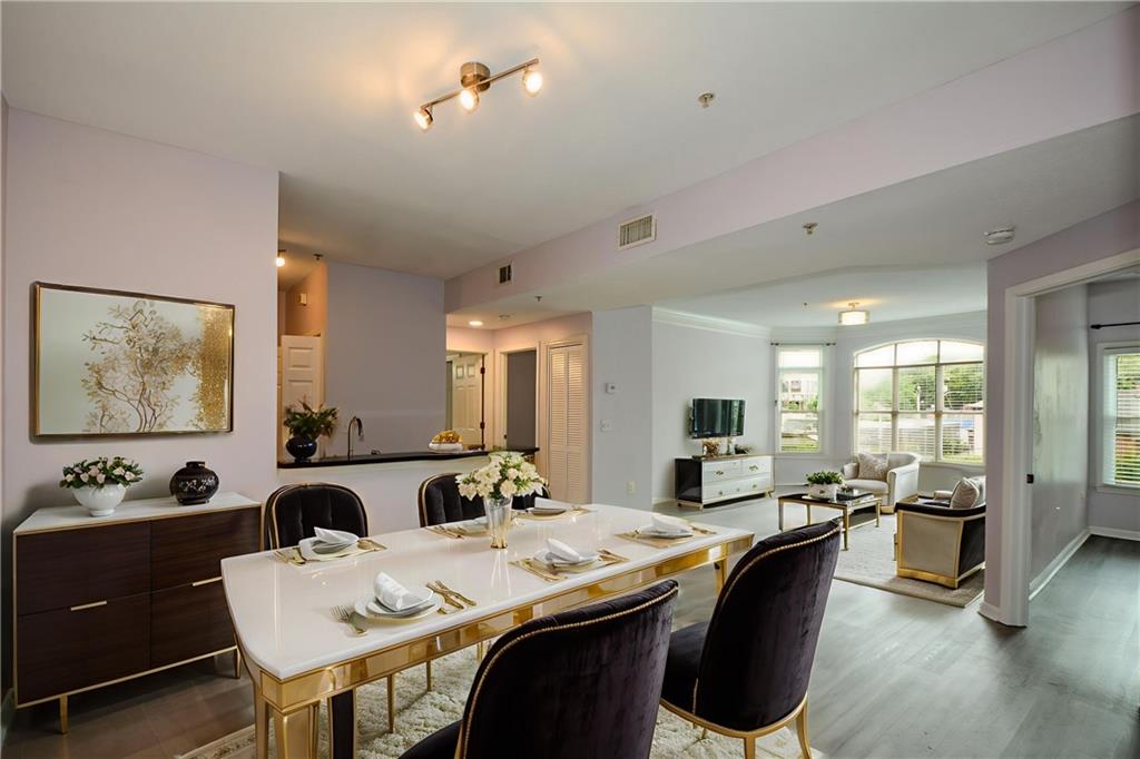 955 Juniper Street Northeast, Unit 4112 Atlanta, GA 30309 - Photo 4 of 27 a view of a dining room with furniture