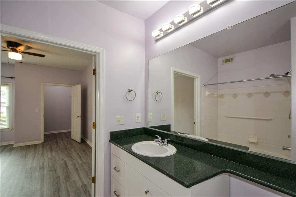 955 Juniper Street Northeast, Unit 4112 Atlanta, GA 30309 - Photo 8 of 27 a bathroom with a sink and a mirror