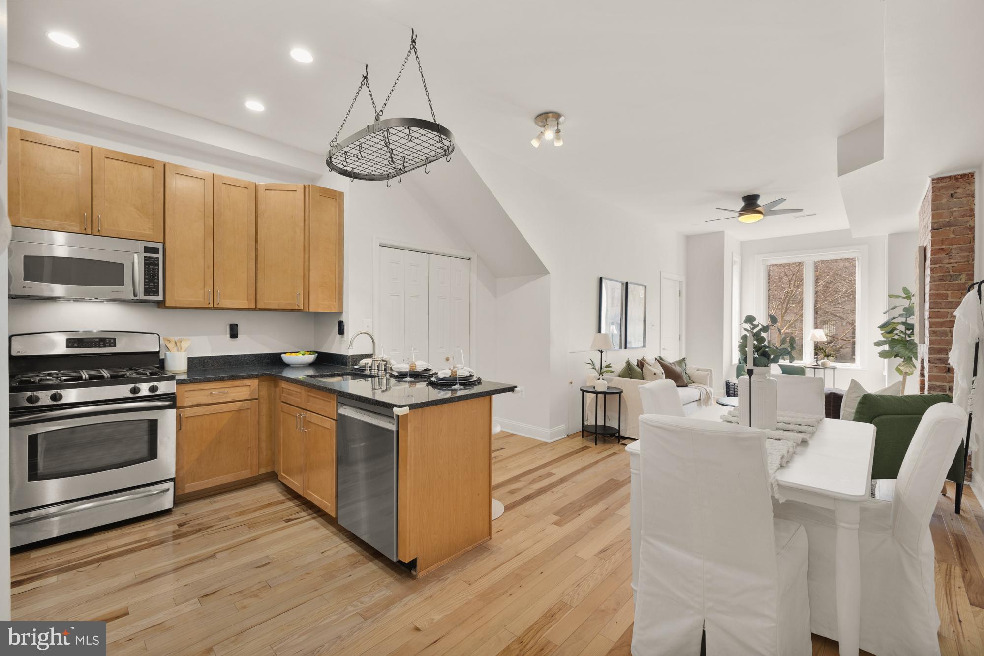 2713 Ontario Road Northwest, Unit 2 Washington, DC 20009 - Photo 14 of 33 a kitchen with stainless steel appliances granite countertop a stove and a wooden floors