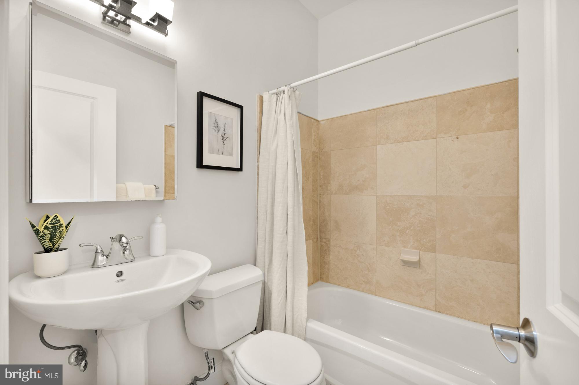 2713 Ontario Road Northwest, Unit 2 Washington, DC 20009 - Photo 20 of 33 a bathroom with a sink toilet and shower