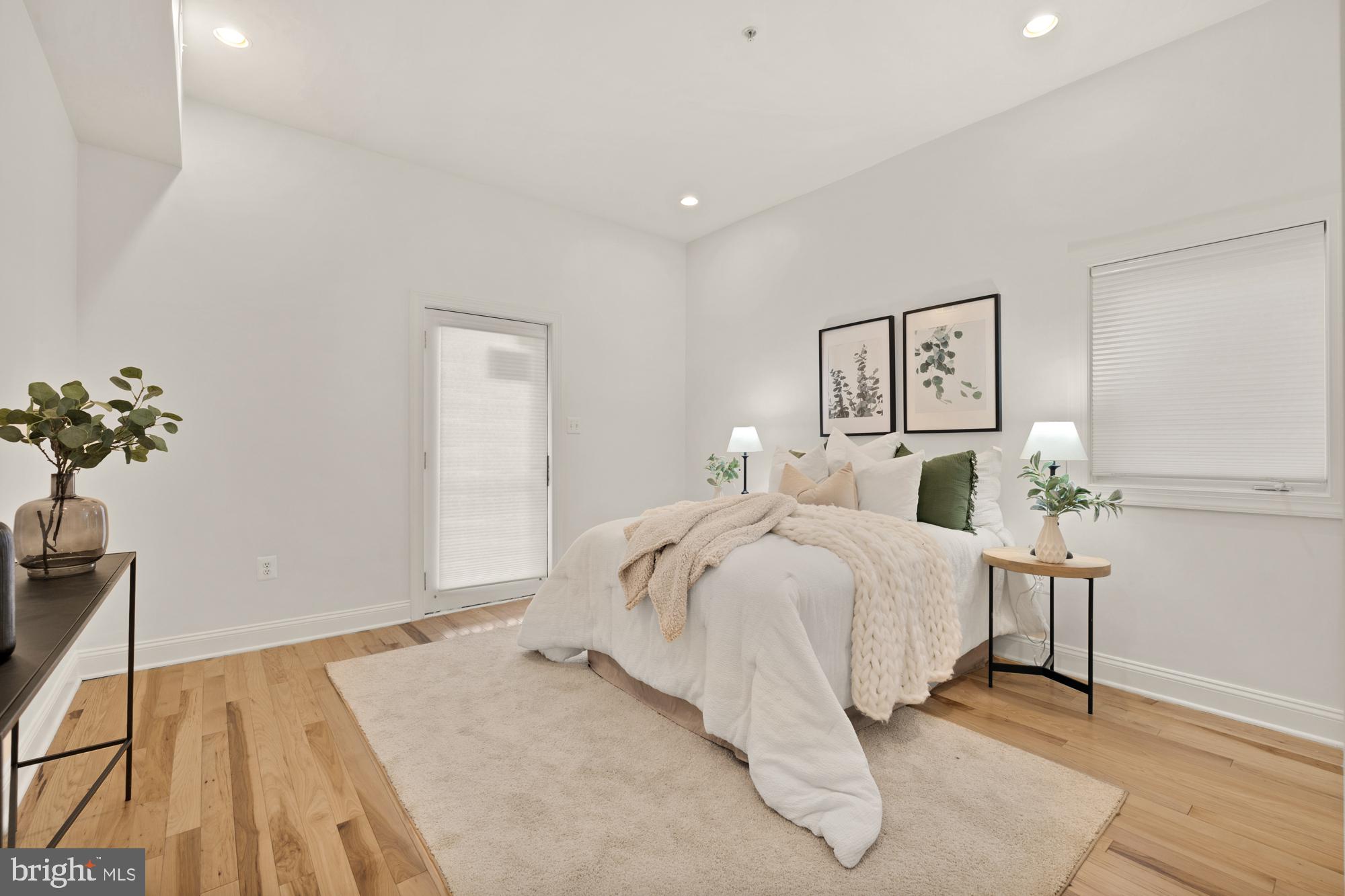2713 Ontario Road Northwest, Unit 2 Washington, DC 20009 - Photo 24 of 33 a bedroom with a bed and a potted plant