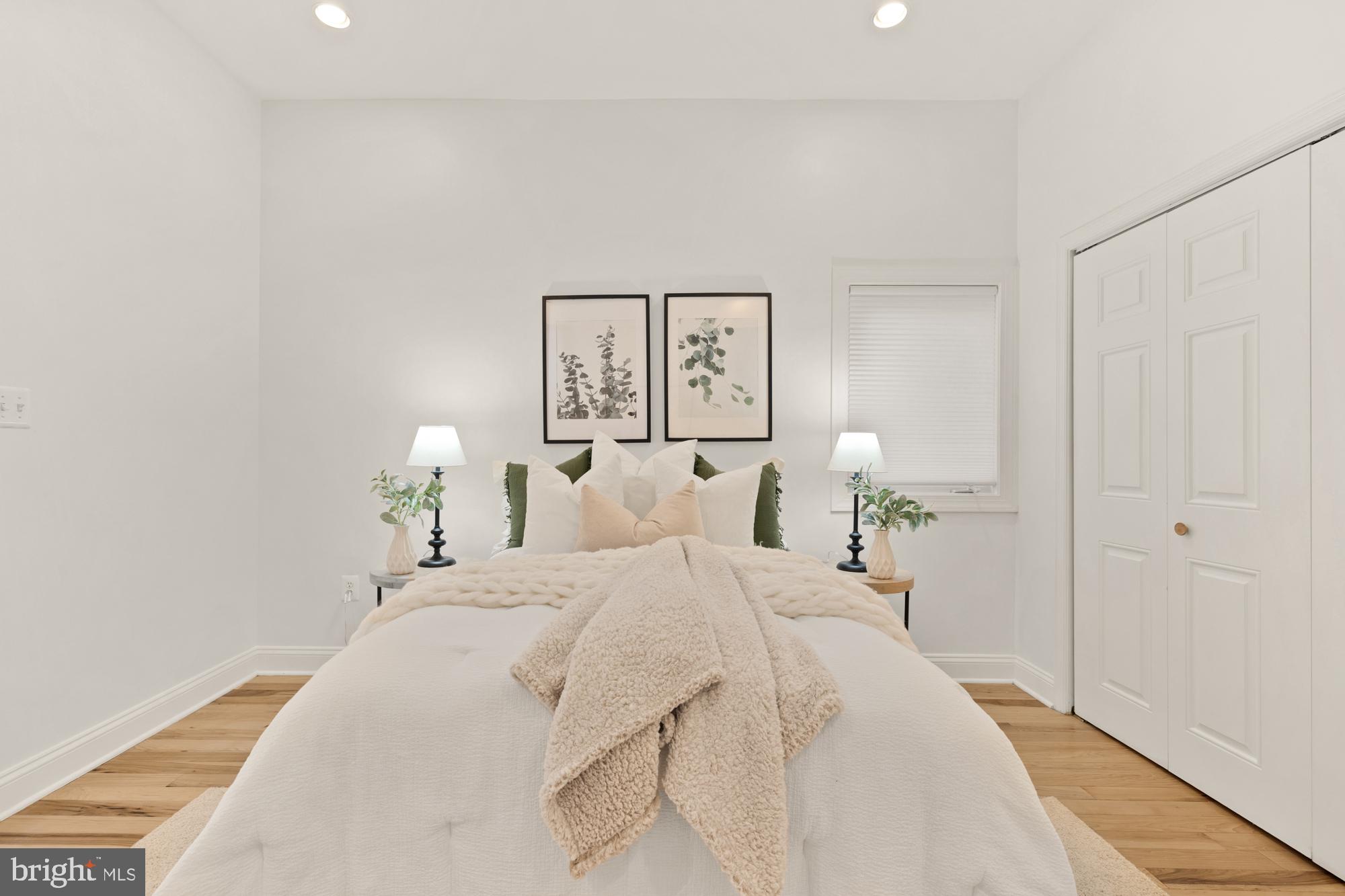 2713 Ontario Road Northwest, Unit 2 Washington, DC 20009 - Photo 25 of 33 a spacious bedroom with a bed and a lamp