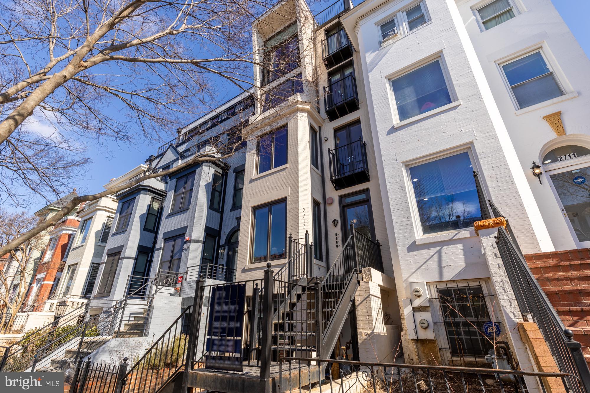 2713 Ontario Road Northwest, Unit 2 Washington, DC 20009 - Photo 28 of 33 a view of a building with many windows