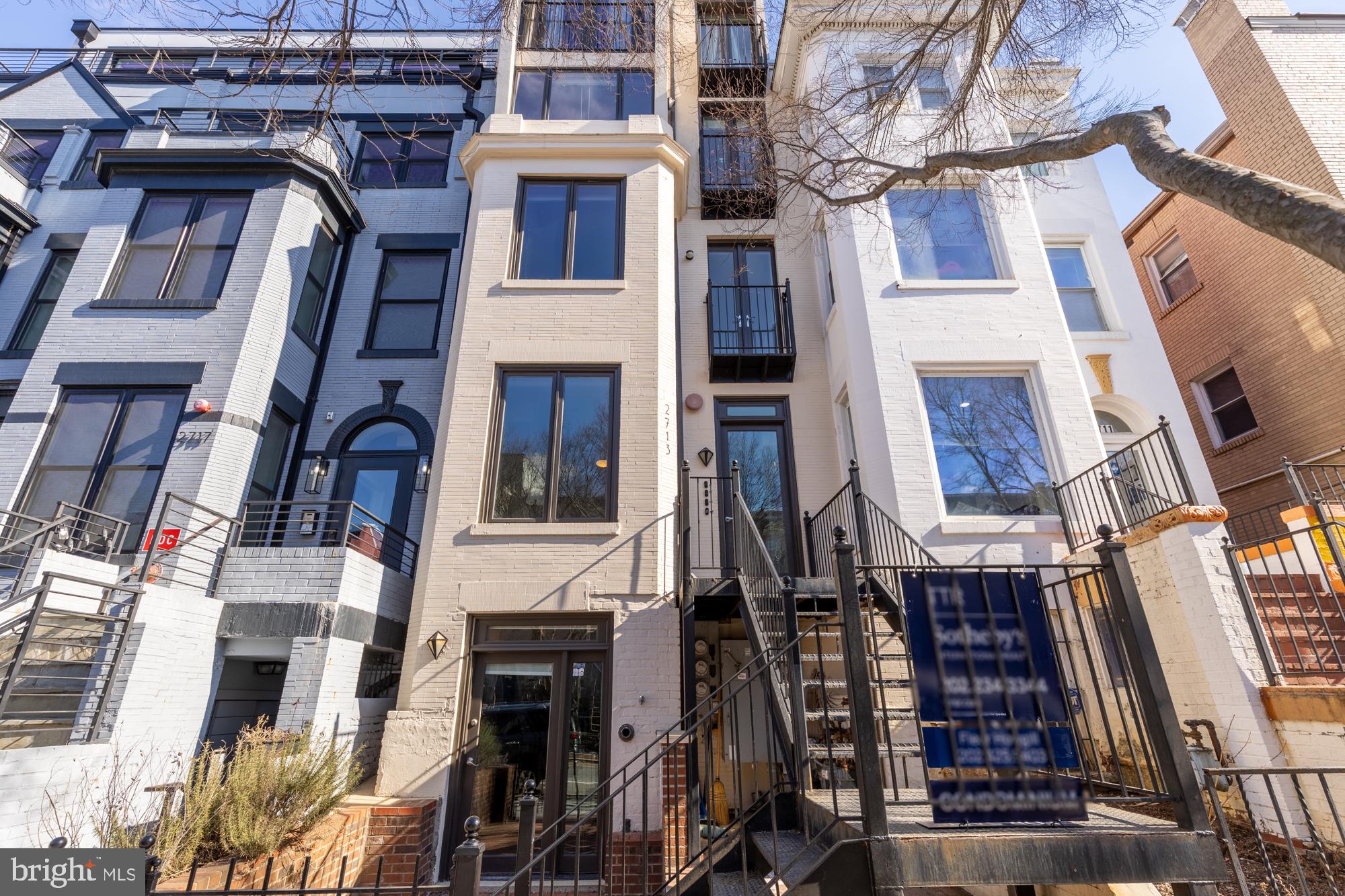 2713 Ontario Road Northwest, Unit 2 Washington, DC 20009 - Photo 29 of 33 a view of a building with many windows