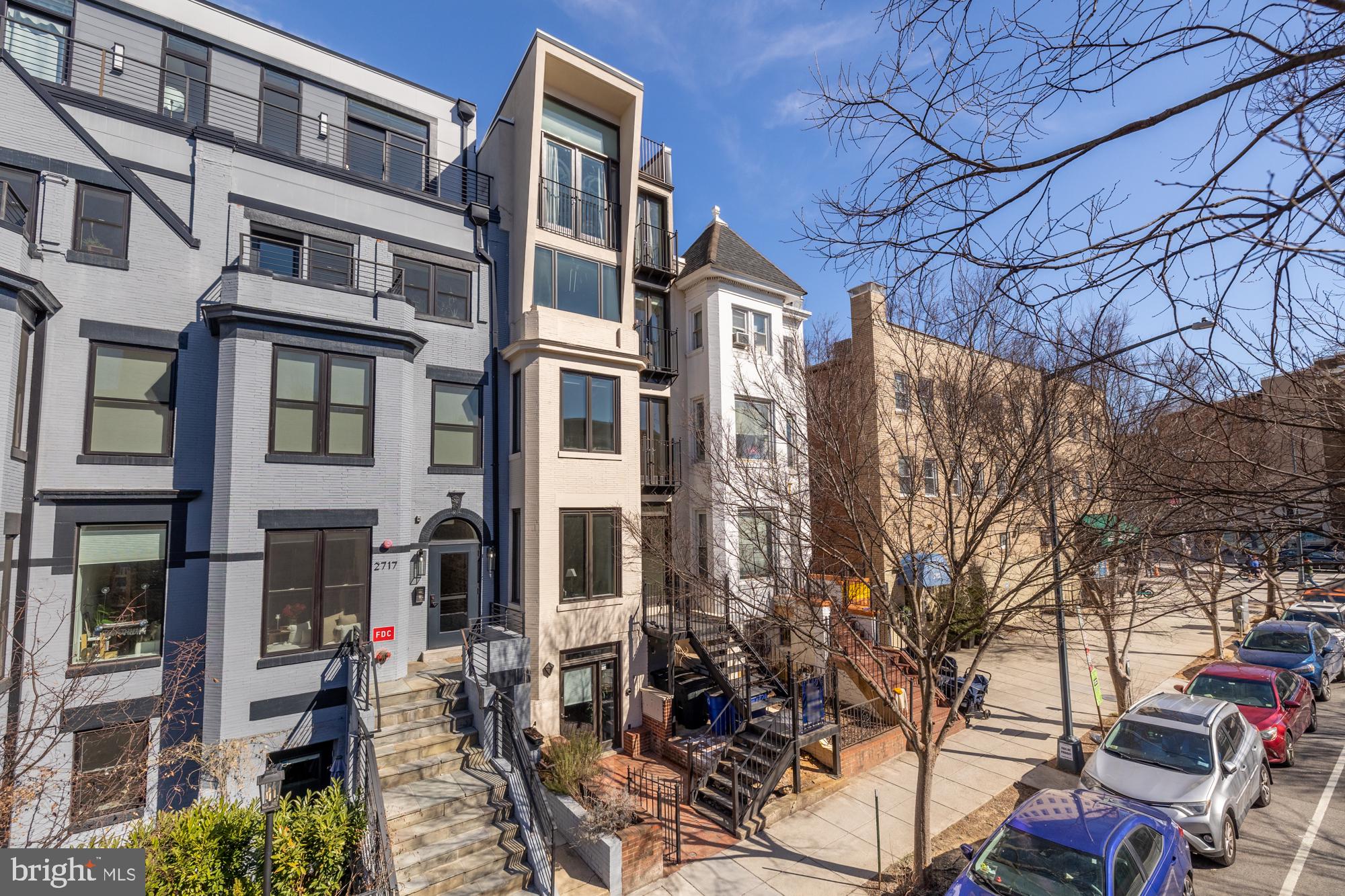 2713 Ontario Road Northwest, Unit 2 Washington, DC 20009 - Photo 31 of 33 a front view of a building with large trees