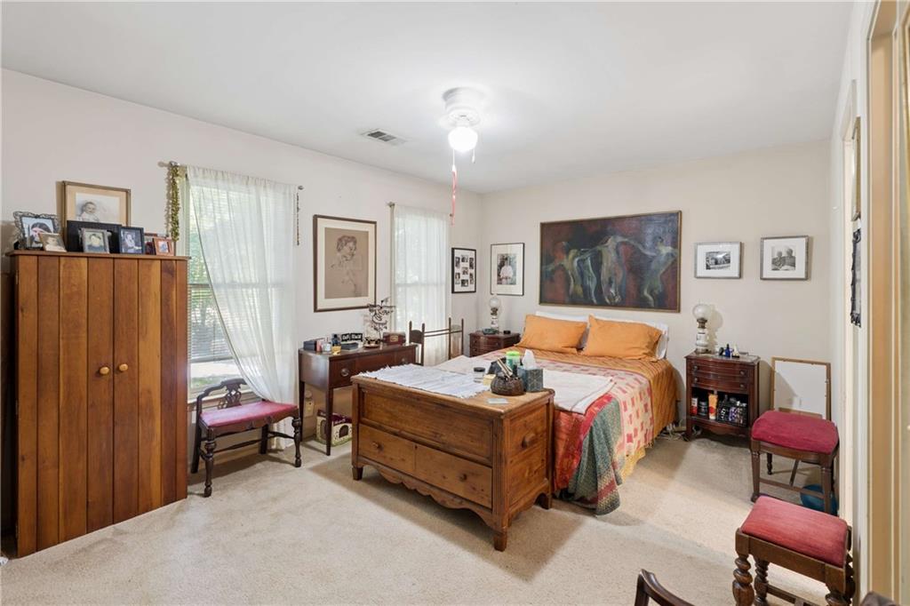 795 North Parkwood Road Decatur, GA 30030 - Photo 16 of 50 a bedroom with a bed and a chair