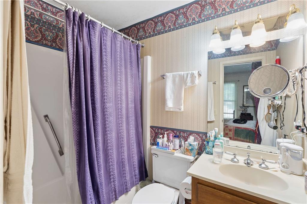 795 North Parkwood Road Decatur, GA 30030 - Photo 18 of 50 a bathroom with a sink vanity mirror and toilet