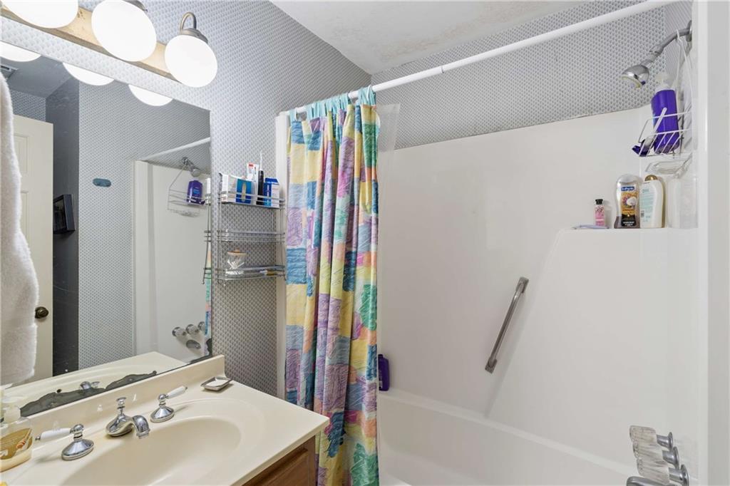 795 North Parkwood Road Decatur, GA 30030 - Photo 21 of 50 a bathroom with a sink and a mirror