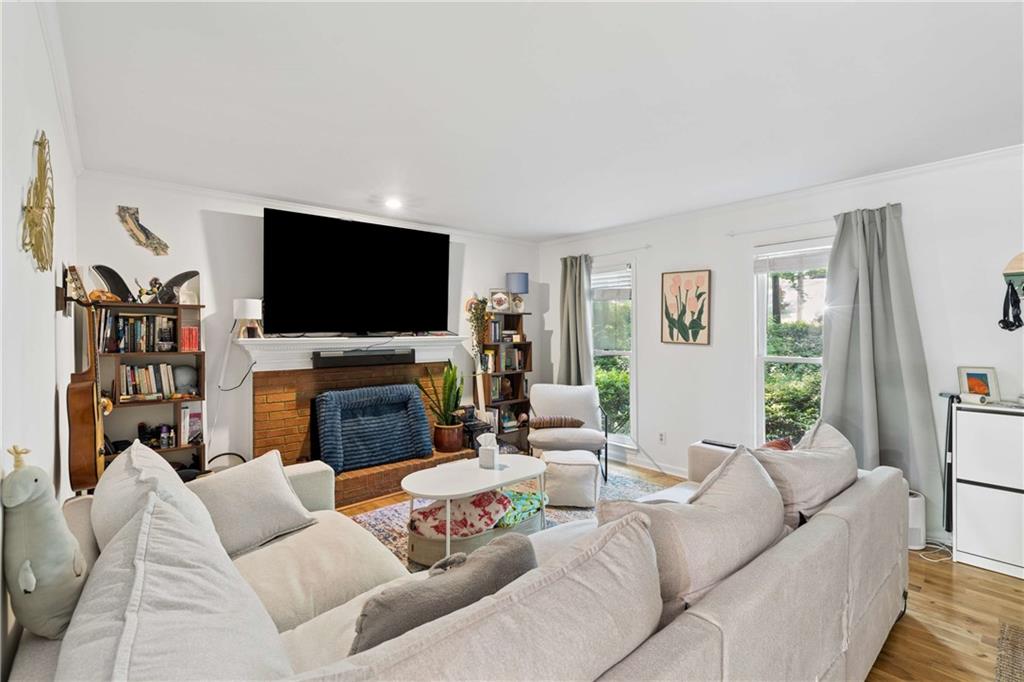795 North Parkwood Road Decatur, GA 30030 - Photo 24 of 50 a living room with fireplace furniture and a flat screen tv