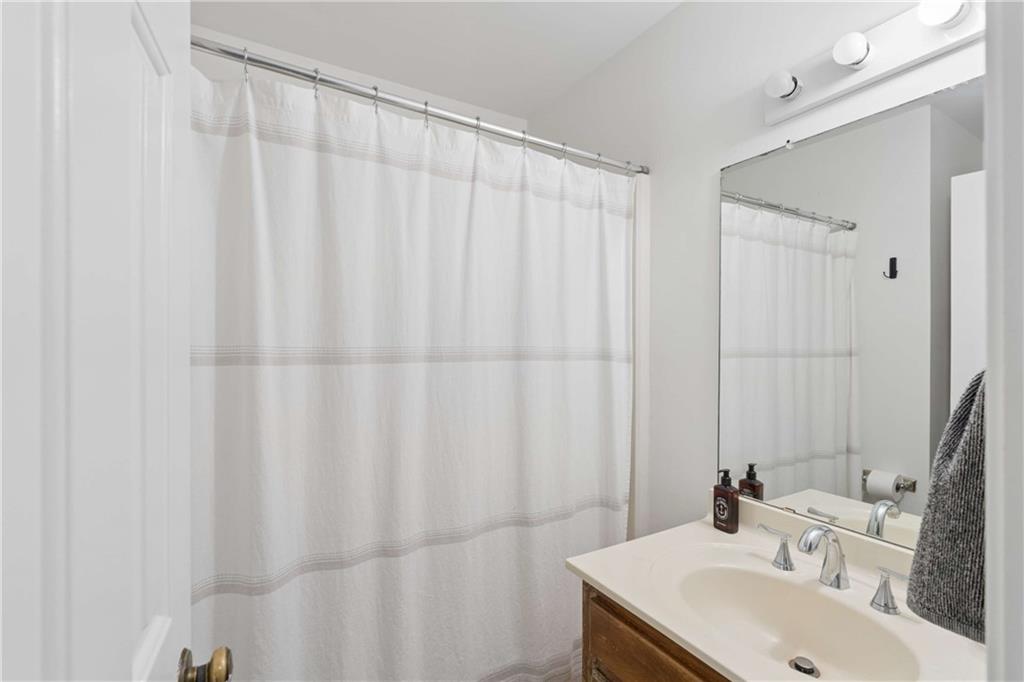 795 North Parkwood Road Decatur, GA 30030 - Photo 41 of 50 a bathroom with a sink and a mirror