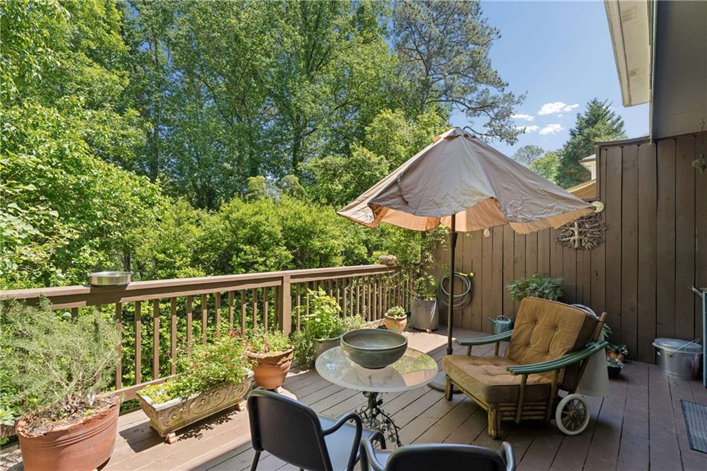 795 North Parkwood Road Decatur, GA 30030 - Photo 43 of 50 a deck with hardwood table and chairs
