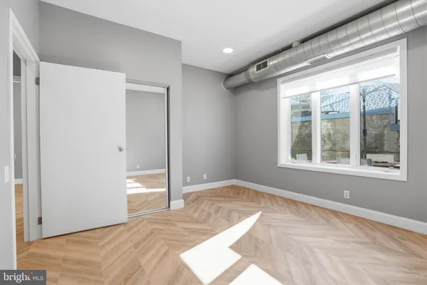 a view of an empty room with a window