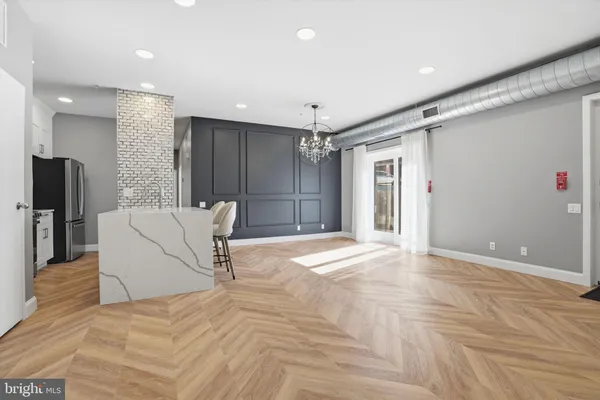 a view of a livingroom with a furniture and a ceiling fan