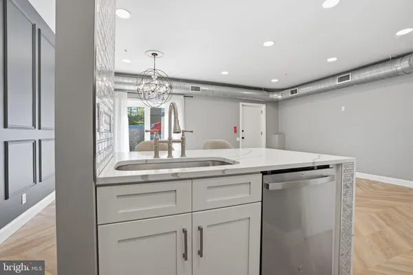a kitchen with a sink and cabinets