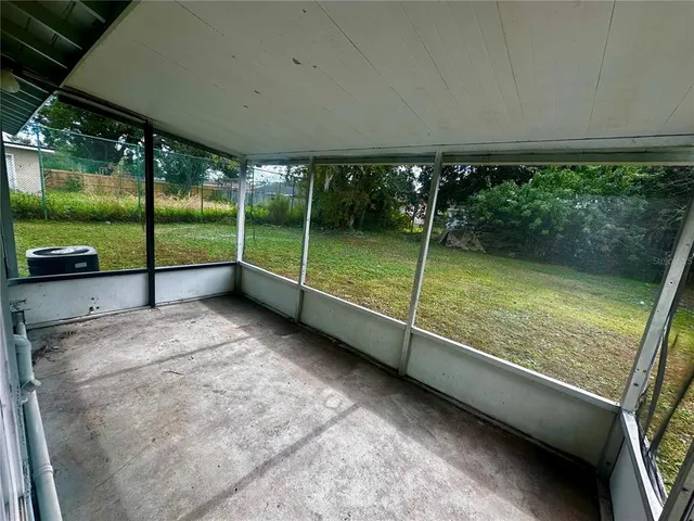 a backyard of a house with lots of green space