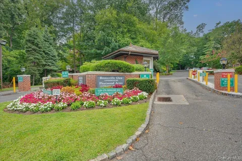 a view of flower garden with wooden fence