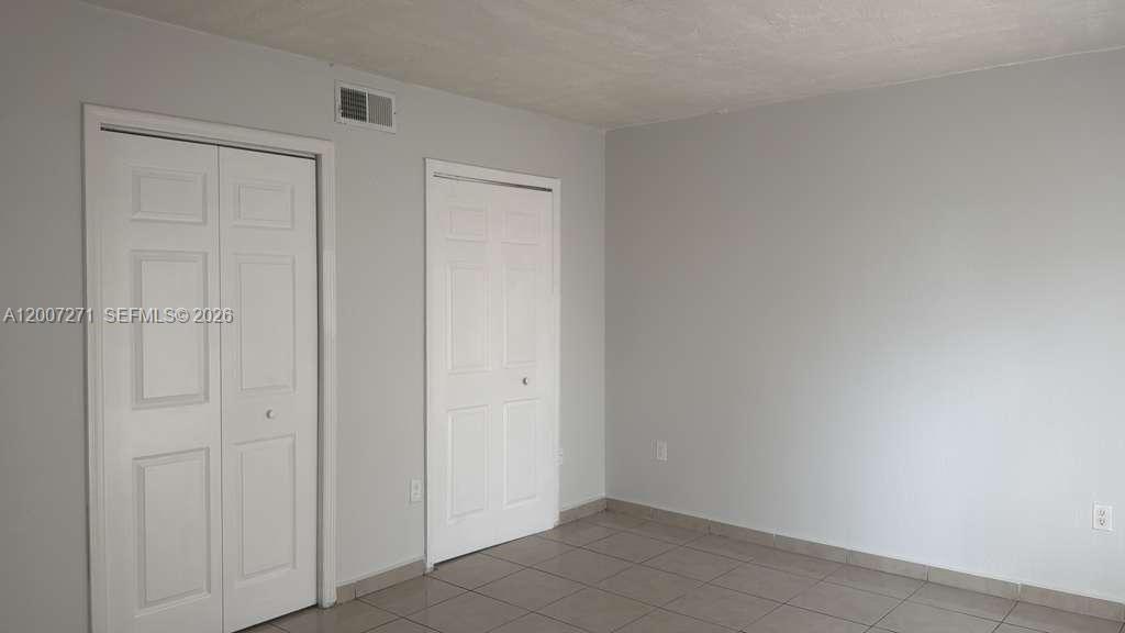 1655 West 44th Place, Unit 451 Hialeah, FL 33012 - Photo 11 of 12 a view of an empty room