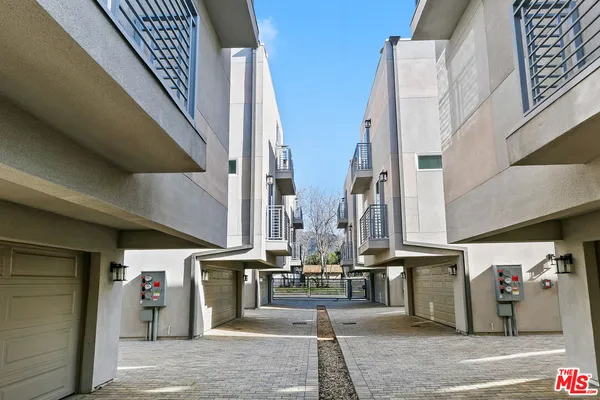a view of a building with traffic signal lights