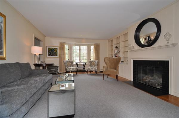 115 Winding River Road Needham, MA 02492 - Photo 2 of 15 a living room with furniture and a fireplace