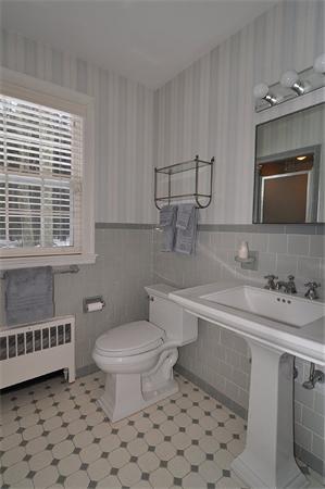 115 Winding River Road Needham, MA 02492 - Photo 10 of 15 a bathroom with a sink toilet a mirror and shower