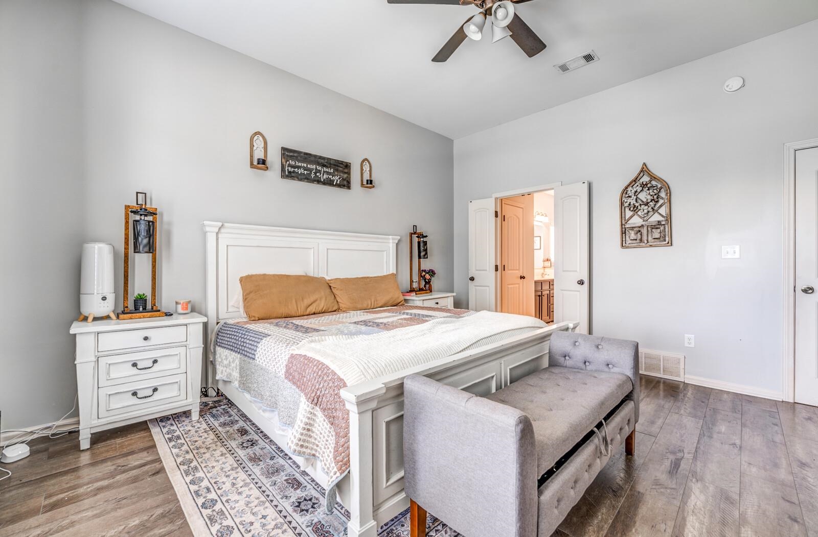 4671 Hampton Ridge Lane Bartlett, TN 38002 - Photo 24 of 40 Spacious bedroom featuring wood-finish flooring, a ceiling fan, and light gray walls