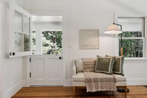 a spacious bedroom with a bed and a couch