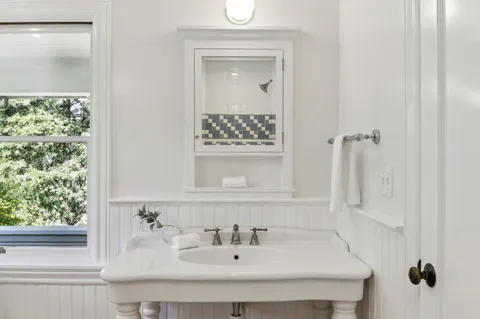 a bed room with a bed and a lamp