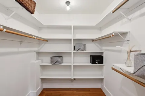 a view of a kitchen with a sink and a large window