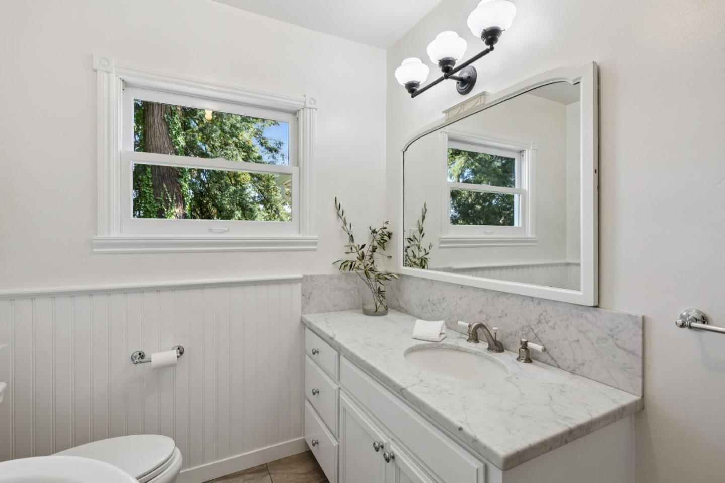 653 Larkin Valley Road Watsonville, CA 95076 - Photo 37 of 116 a bathroom with a sink a toilet and a mirror