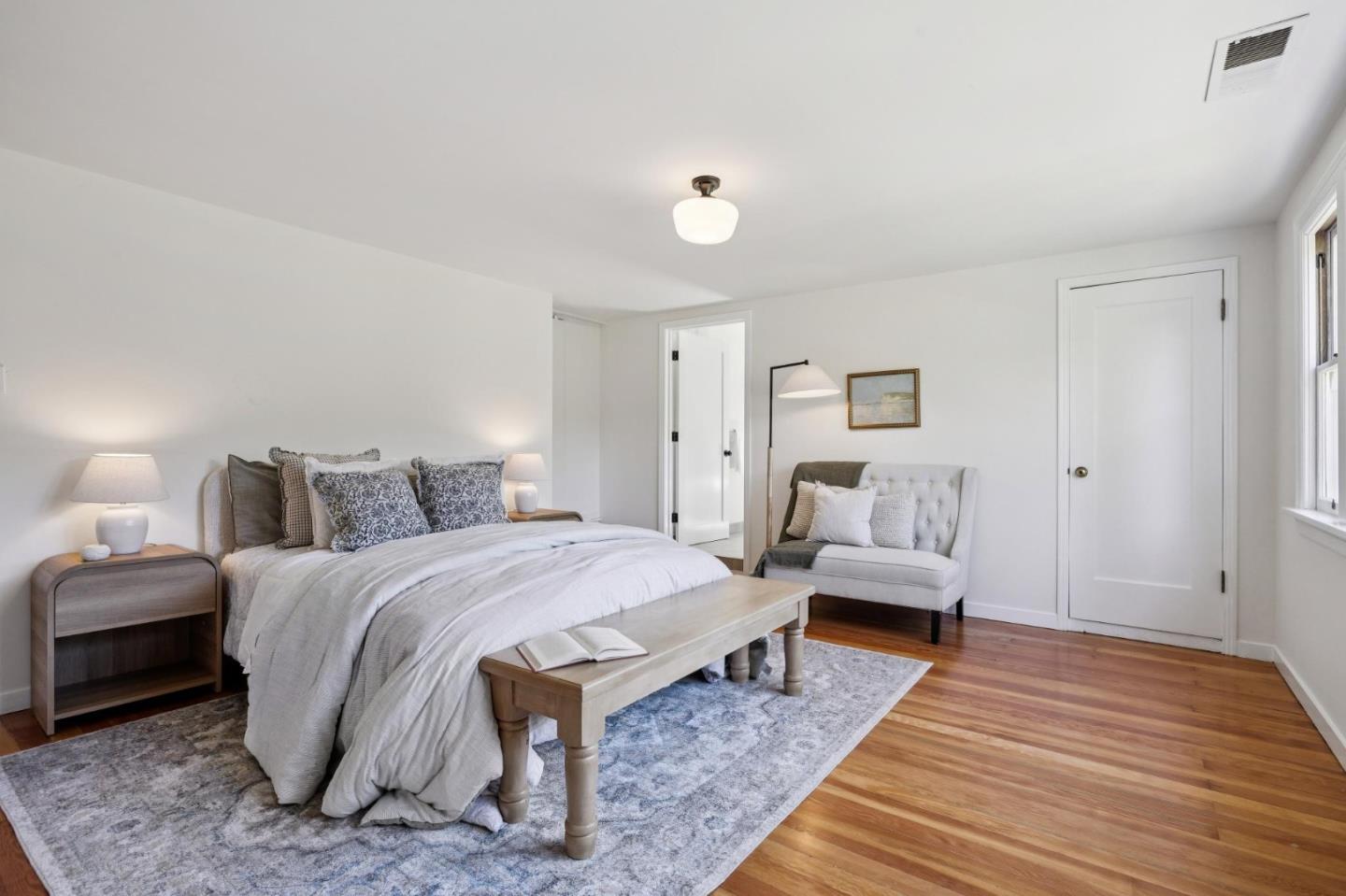 653 Larkin Valley Road Watsonville, CA 95076 - Photo 45 of 116 a spacious bedroom with a bed and a couch