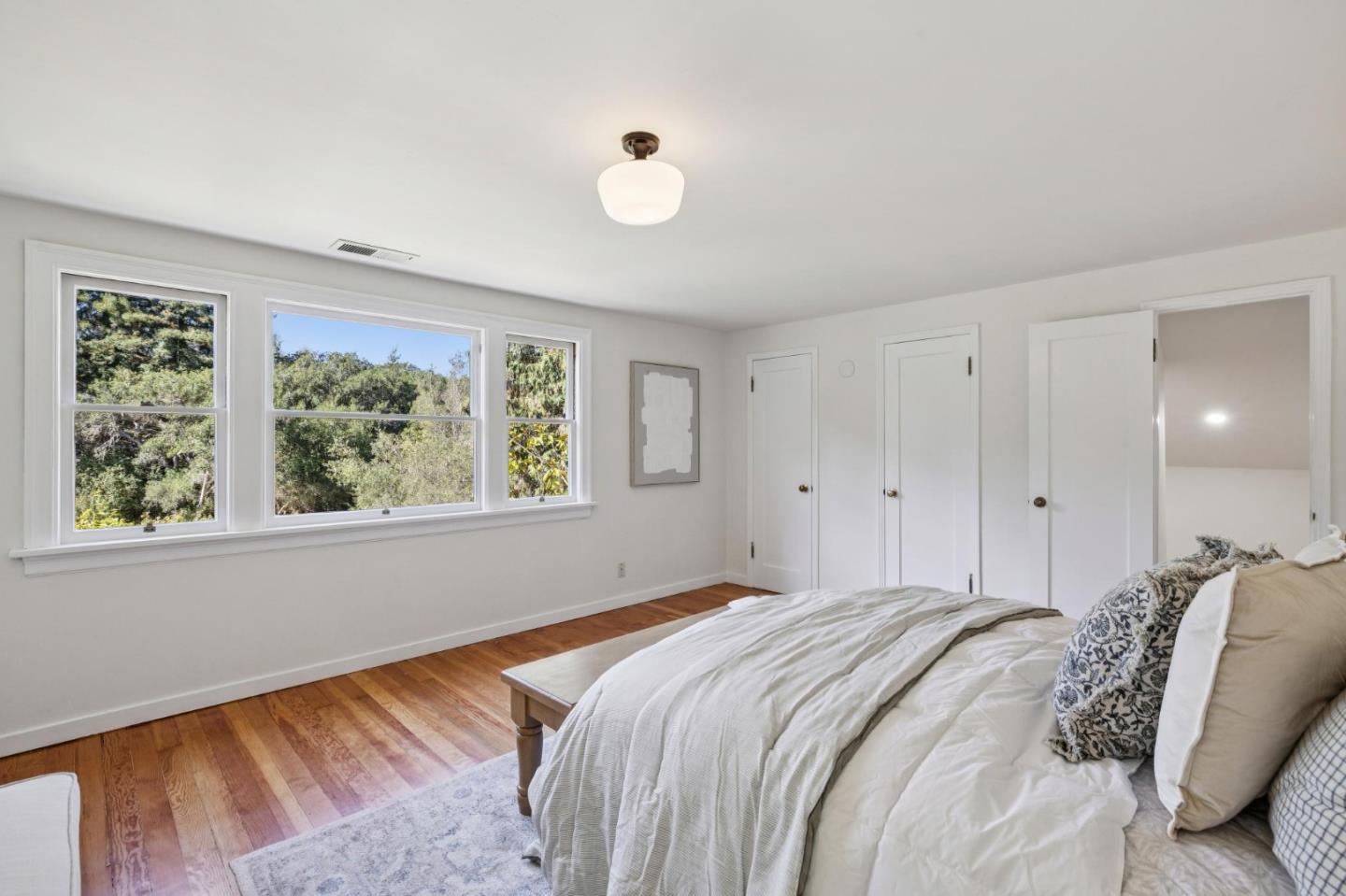 653 Larkin Valley Road Watsonville, CA 95076 - Photo 46 of 116 a bedroom with a bed and a large window