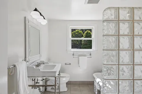 an aerial view of a house with yard and street view