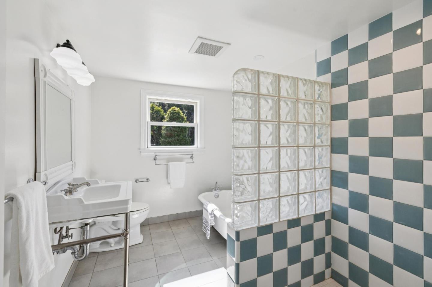 653 Larkin Valley Road Watsonville, CA 95076 - Photo 50 of 116 a bathroom with a sink a toilet and shower