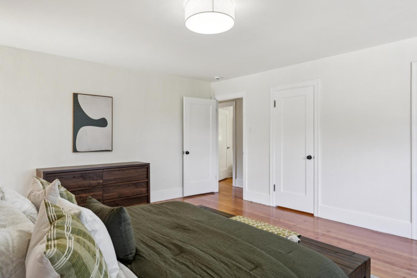 653 Larkin Valley Road Watsonville, CA 95076 - Photo 53 of 116 a bed room with a bed and a lamp