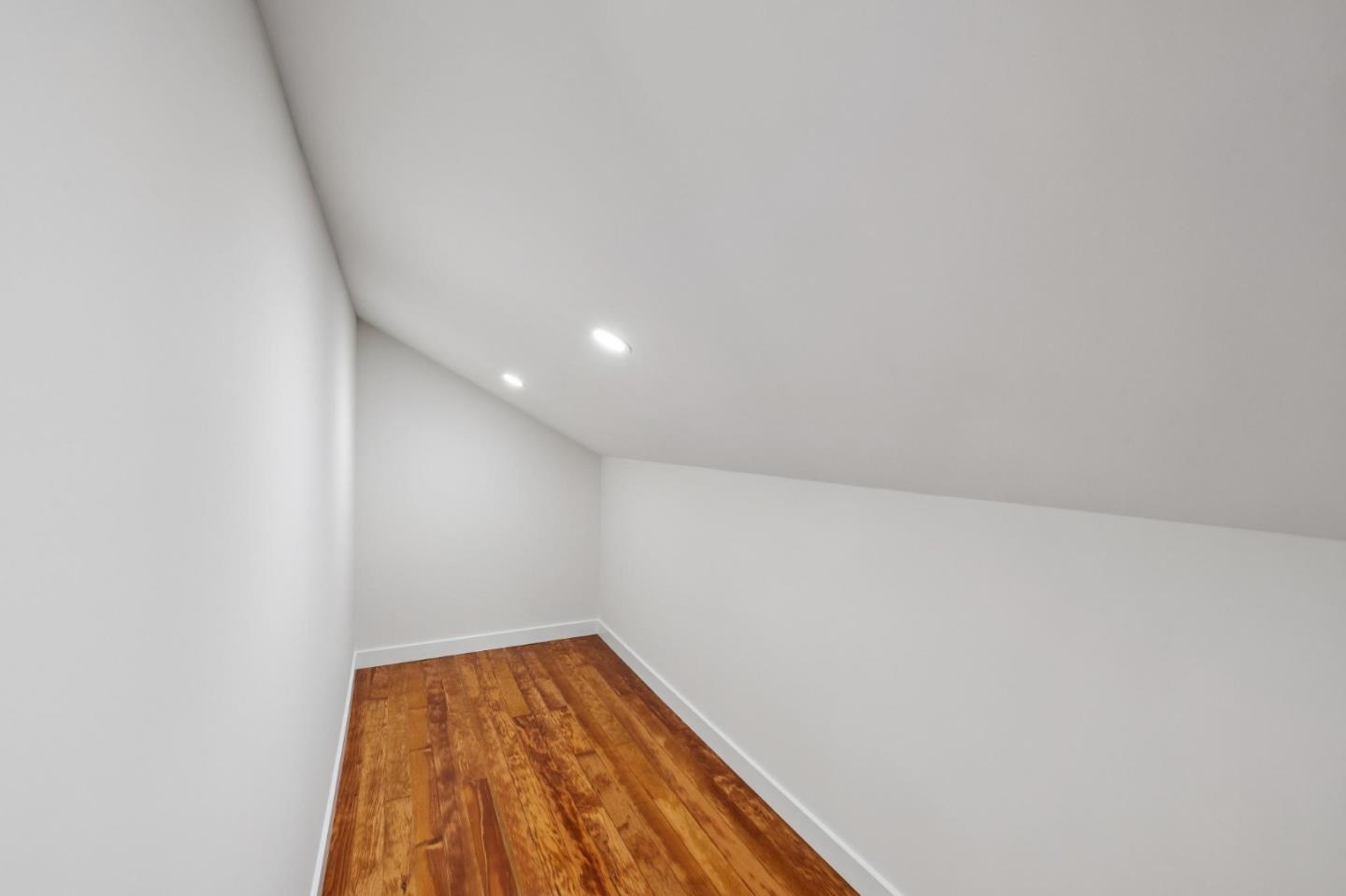 653 Larkin Valley Road Watsonville, CA 95076 - Photo 55 of 116 a view of a room with wooden floor and bench