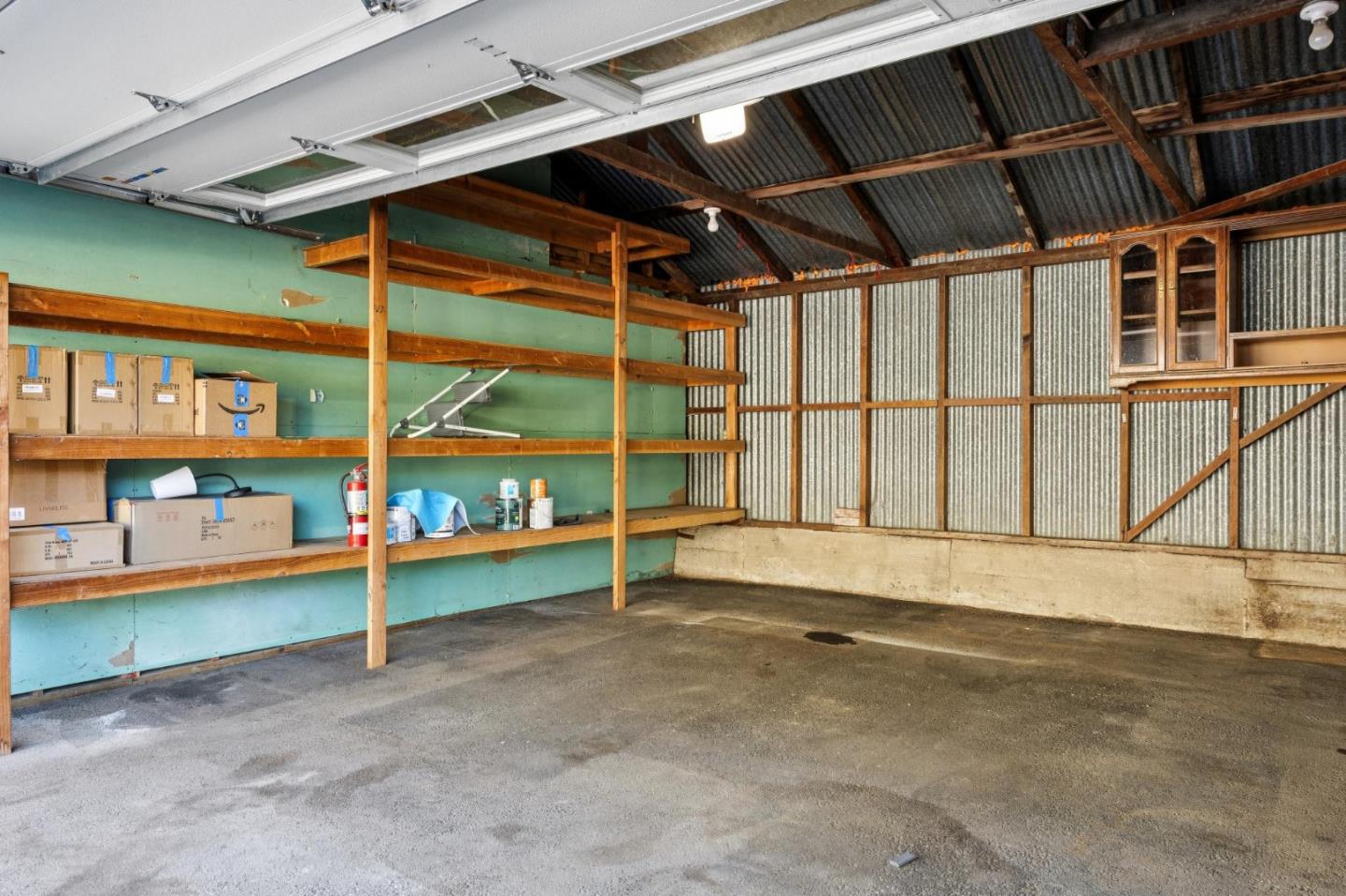 653 Larkin Valley Road Watsonville, CA 95076 - Photo 68 of 116 a view of an empty room with a garage