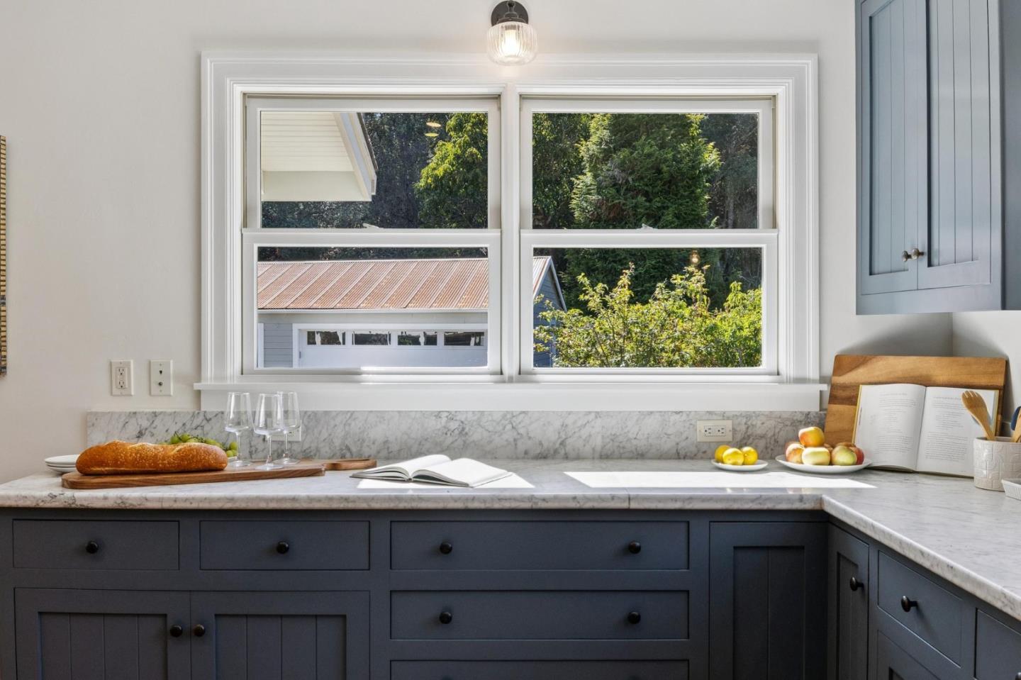 653 Larkin Valley Road Watsonville, CA 95076 - Photo 7 of 116 a bathroom with a granite countertop sink and a window