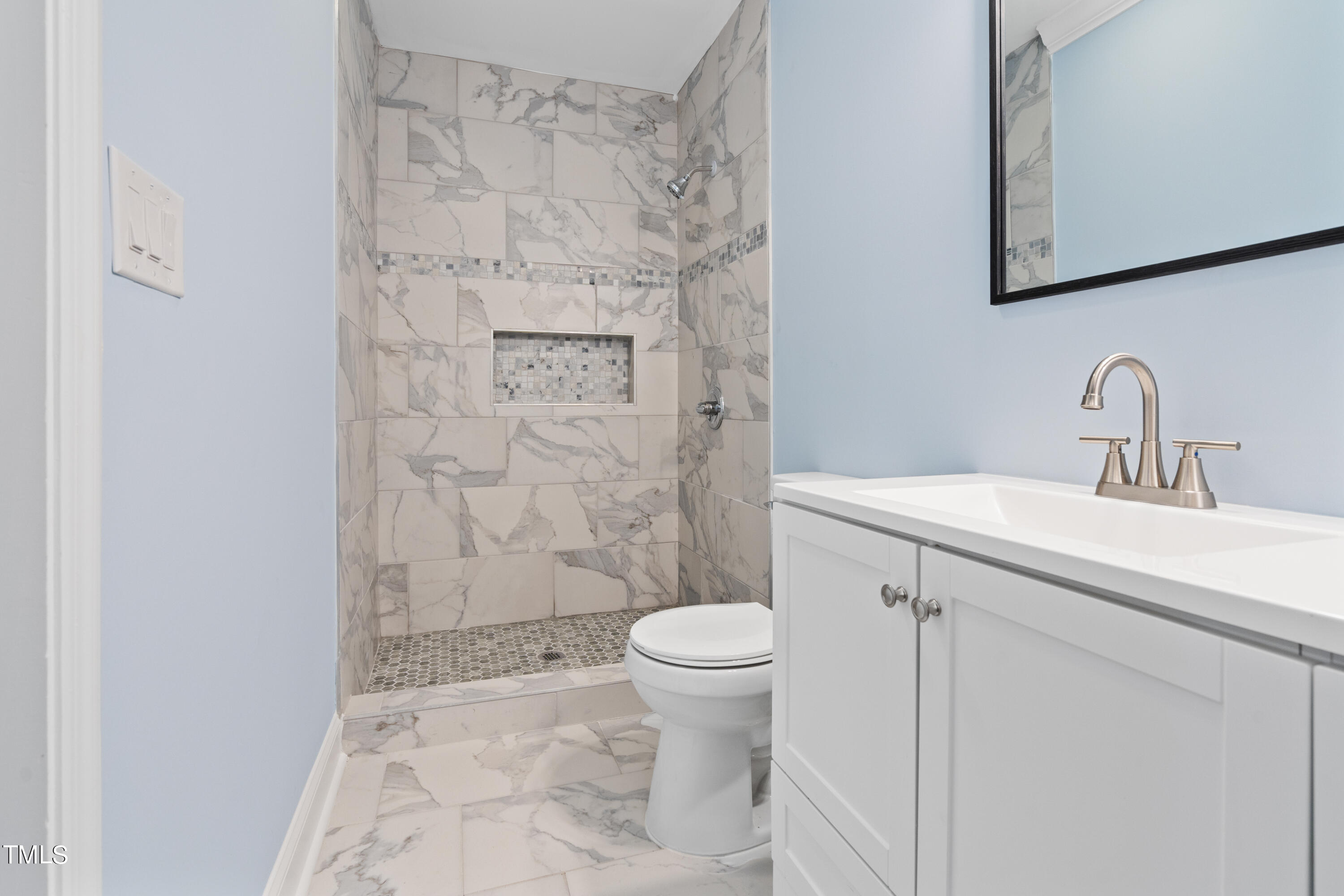 244 Semora Road Roxboro, NC 27573 - Photo 17 of 42 a bathroom with a sink toilet and shower