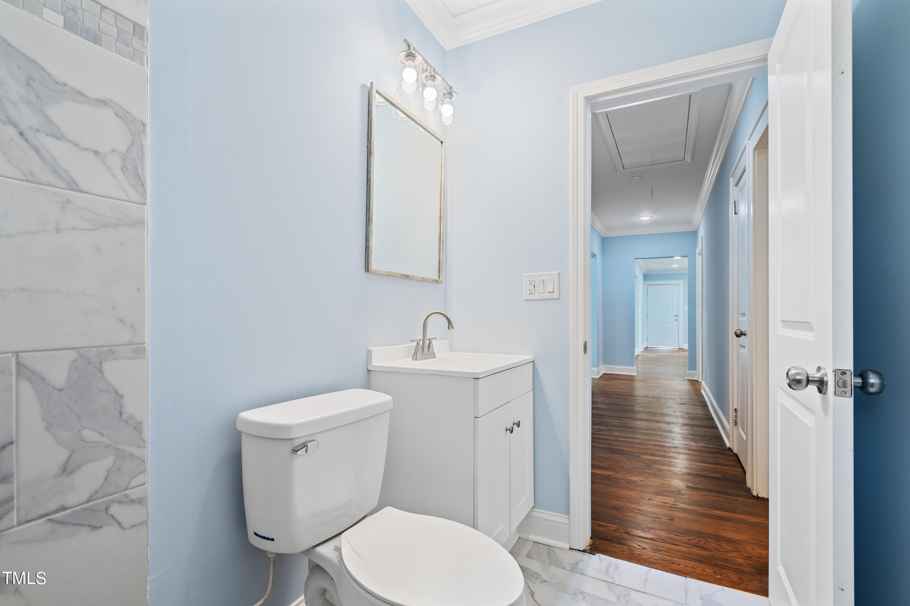 244 Semora Road Roxboro, NC 27573 - Photo 22 of 42 a bathroom with a toilet a sink and mirror