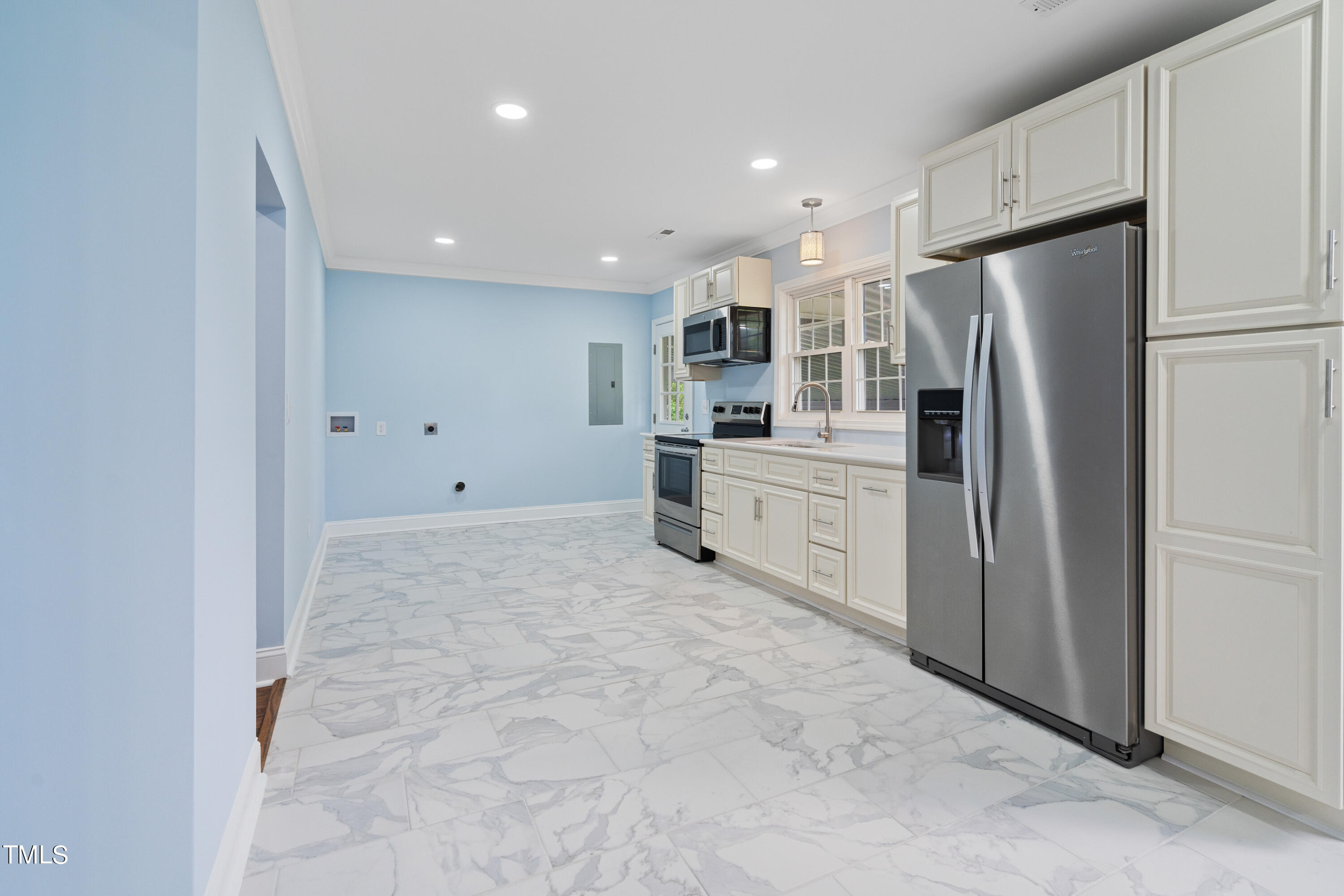 244 Semora Road Roxboro, NC 27573 - Photo 29 of 42 a kitchen with stainless steel appliances a refrigerator sink and microwave