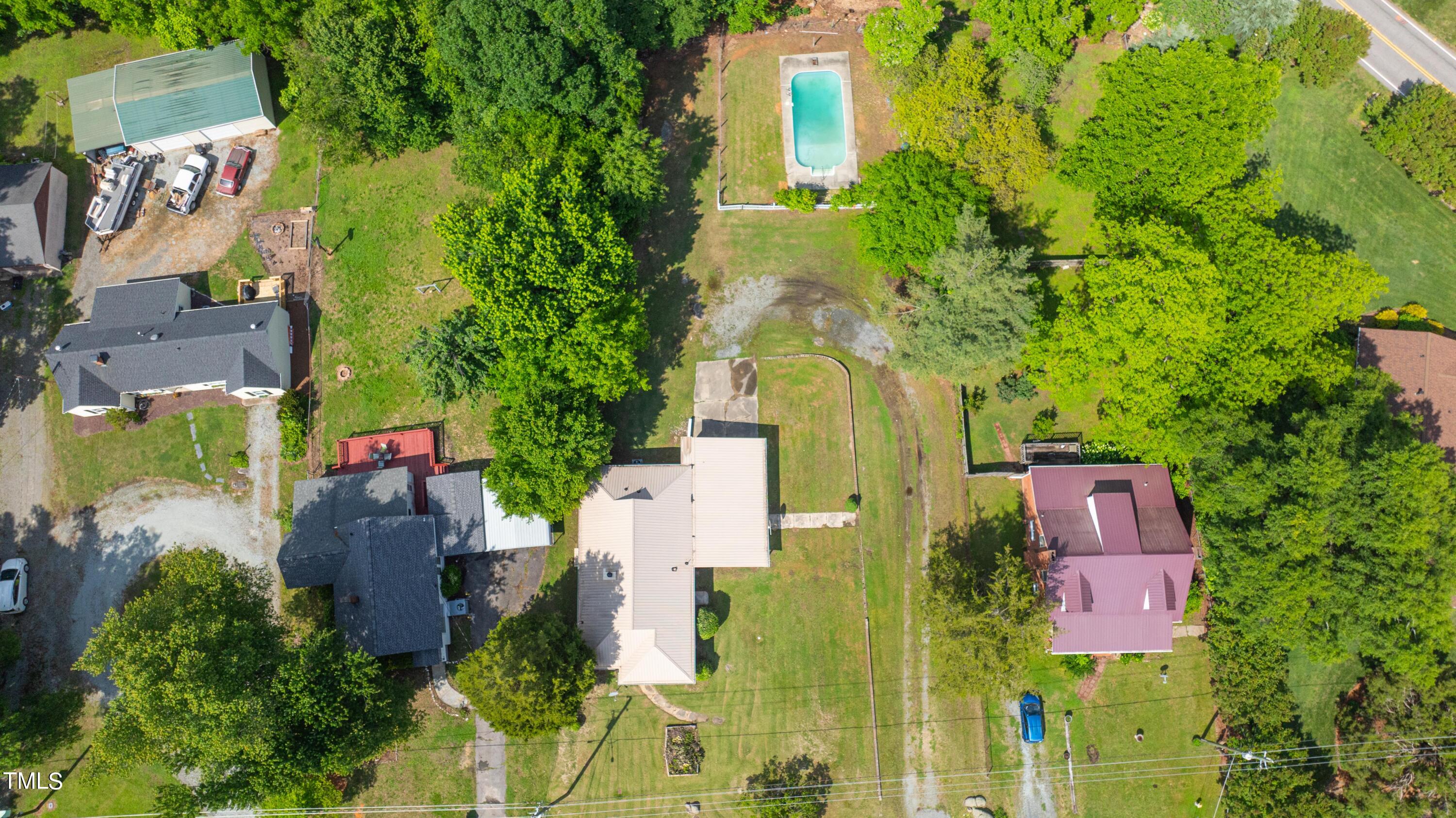 244 Semora Road Roxboro, NC 27573 - Photo 30 of 42 an aerial view of residential houses with outdoor space and street view