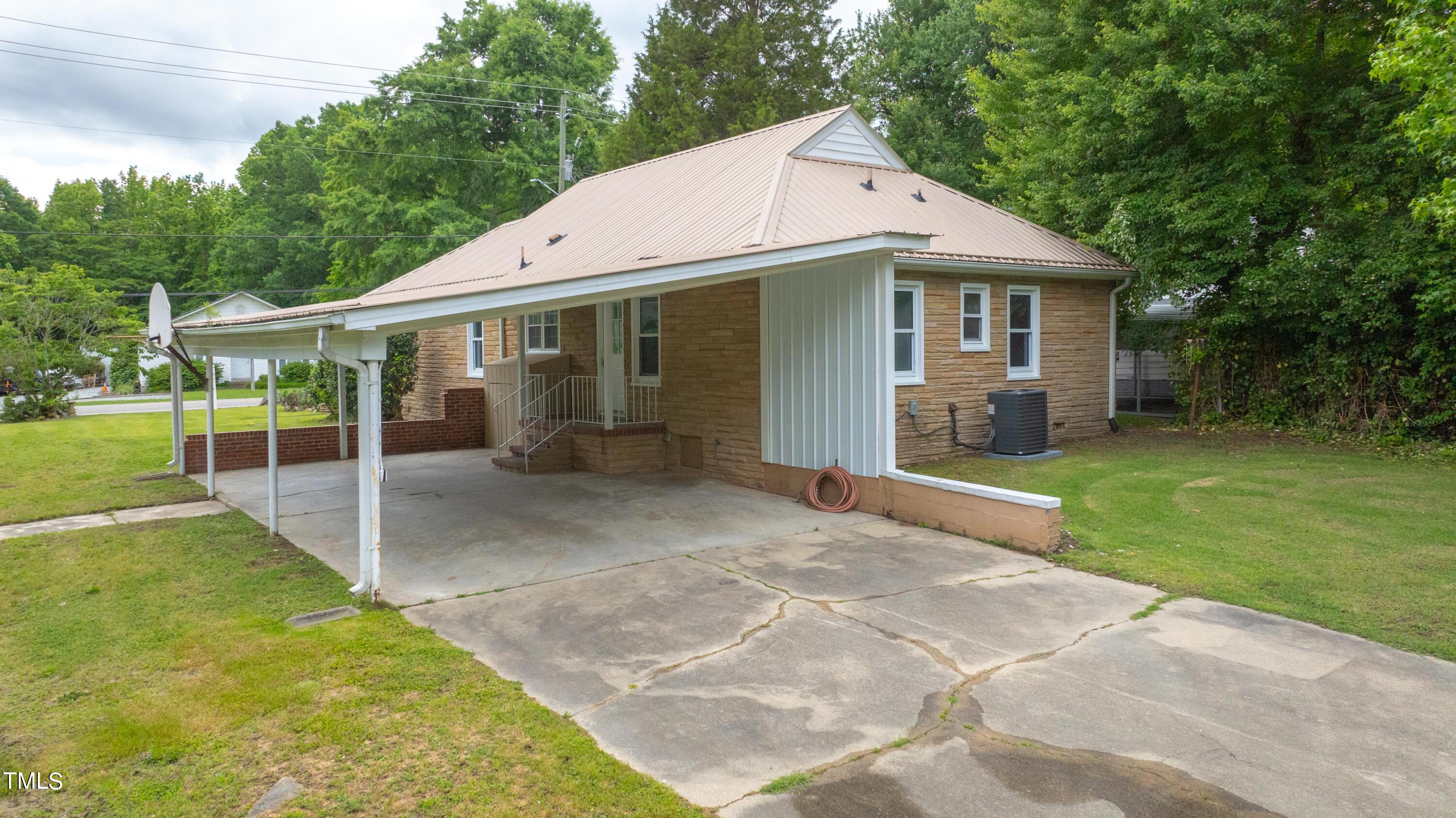 244 Semora Road Roxboro, NC 27573 - Photo 31 of 42 a view of a house with backyard and porch