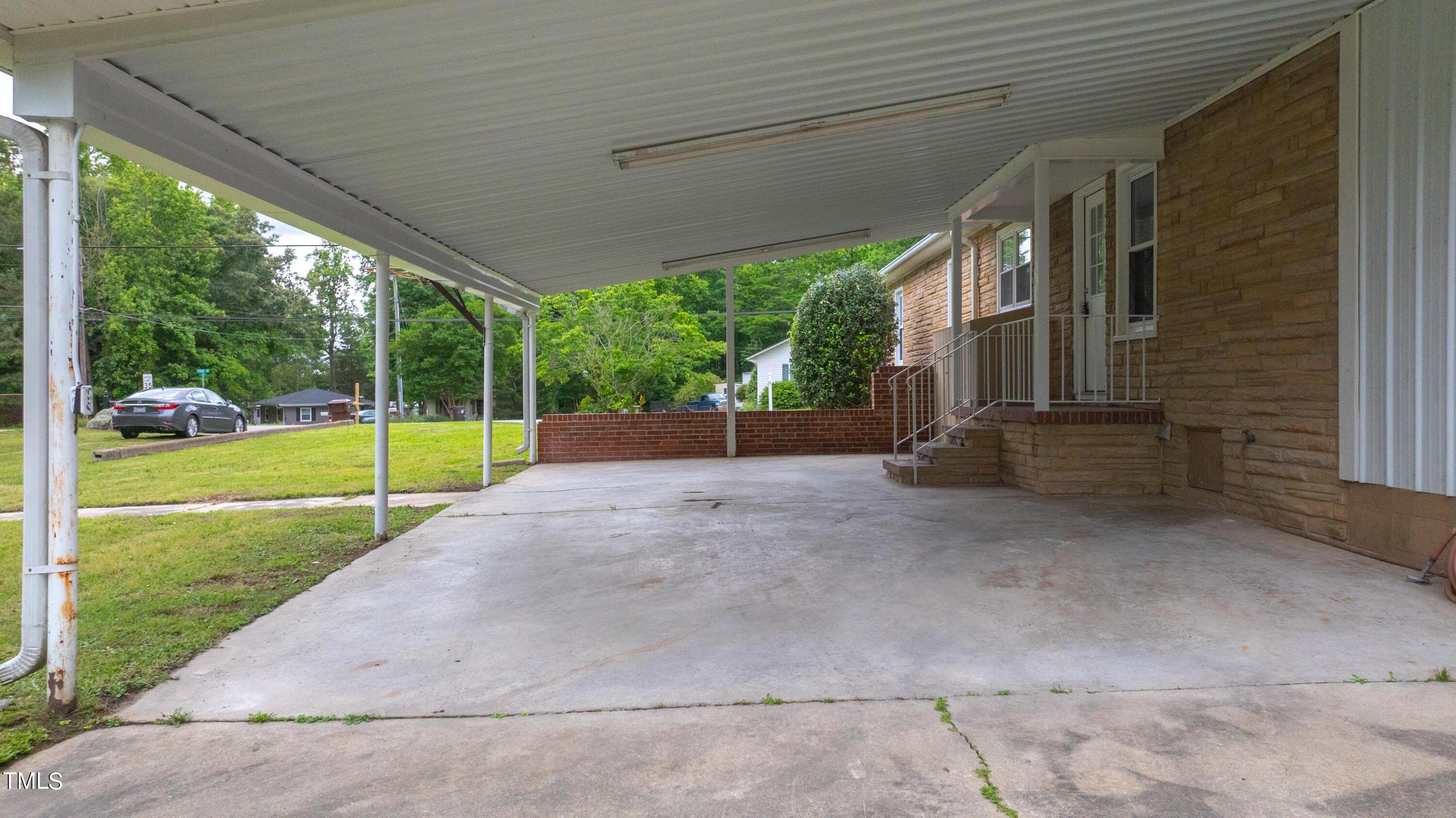 244 Semora Road Roxboro, NC 27573 - Photo 32 of 42 a view of a house with backyard and a backyard