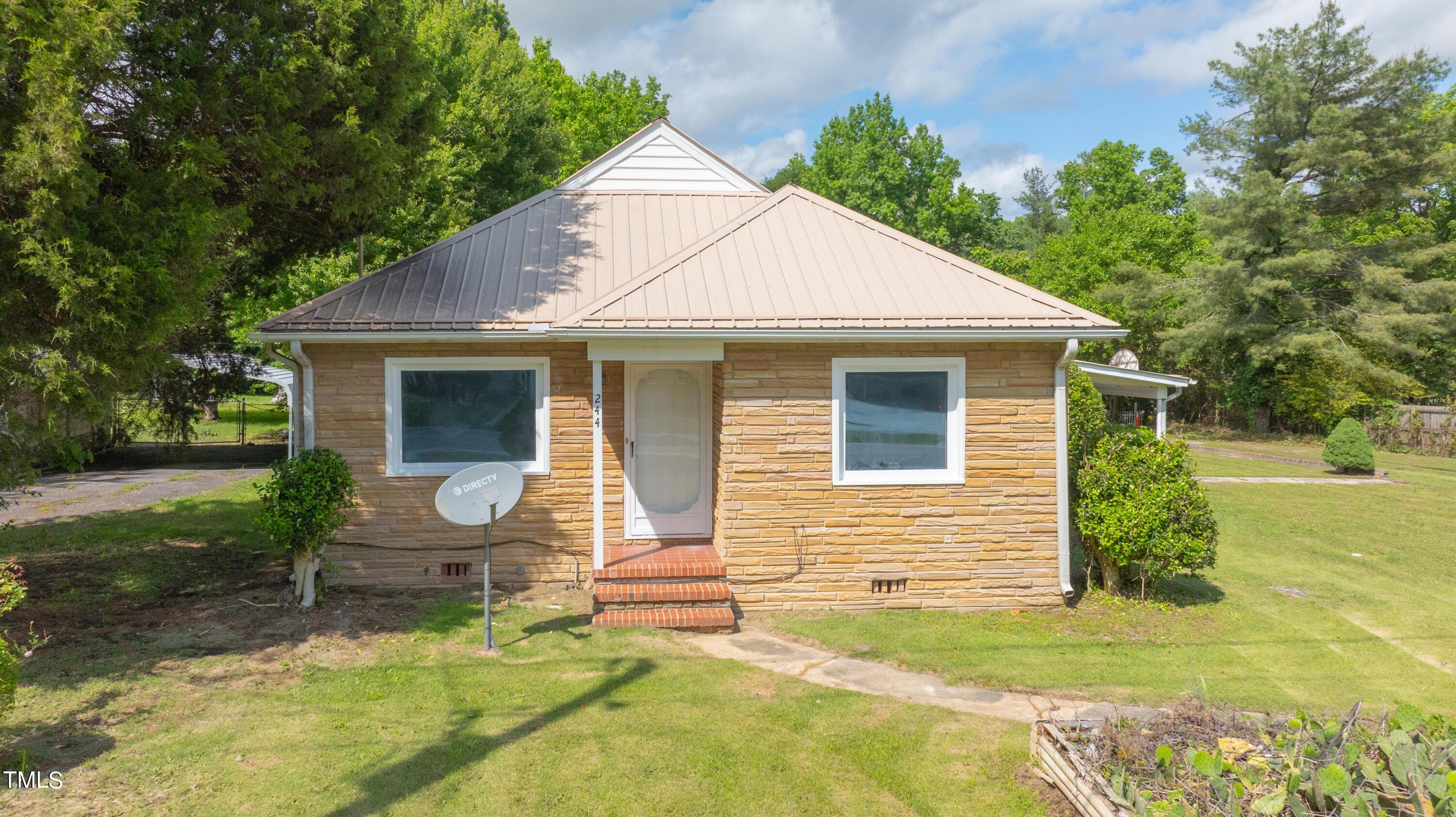 244 Semora Road Roxboro, NC 27573 - Photo 35 of 42 a backyard of a house with seating space