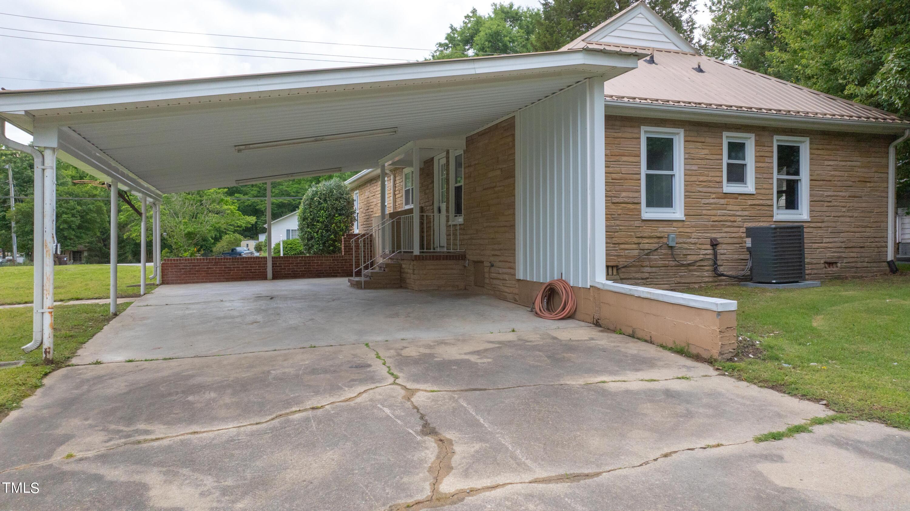 244 Semora Road Roxboro, NC 27573 - Photo 36 of 42 a view of a house with a backyard
