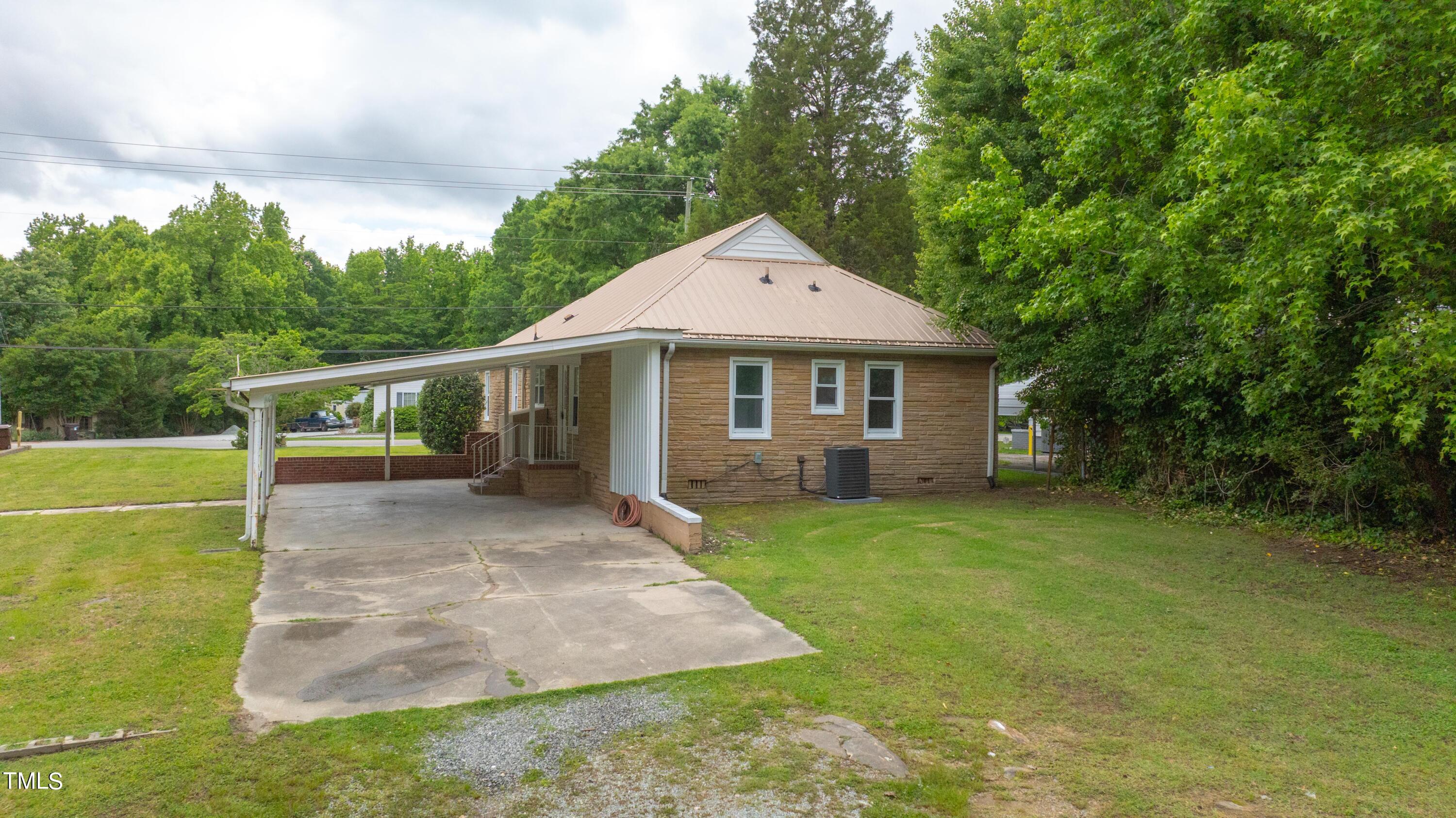 244 Semora Road Roxboro, NC 27573 - Photo 37 of 42 a front view of a house with garden
